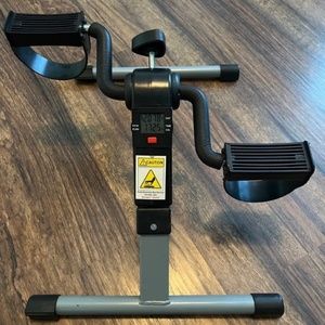 Under desk exercise bicycle machine